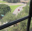 A view from the Sniper's Window onto Dealey Plaza.
