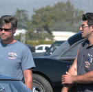 Jeff Thisted and Billy Derian Jr. haggle over a price with a potential buyer of a Corvette at the Pomona Swap Meet.
