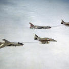 Two A-4F Skyhawks refuel a pair of RF-8G Crusaders in the early 1970s.
