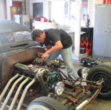 Jeff Thisted works on the engine of a Rat Rod - a style of hot rod that's meant to look a little rough around the edges, even when it's finished.