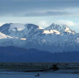 The heat of the day subsides and night moves in across the head of the bay.