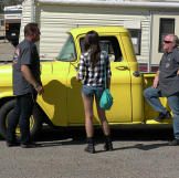 Billy Derian Sr. and head mechanic Mike Dade talk to Kelsi about what can be done to save her screamin' yellow pickup truck.
