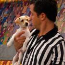 The Ref bonds with a pup.