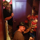 Turtleman (Ernie Brown, Jr.) and Neal James search the hair salon for potential critters.