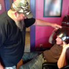 Turtleman (Ernie Brown, Jr.) and Neal James have fun at the hair salon during their nuisance call.