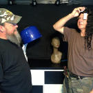 Turtleman (Ernie Brown, Jr.) and Neal James have fun at the hair salon during their nuisance call.