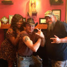 Turtleman (Ernie Brown, Jr.) and Neal James with hair salon owner Velma Trayham.