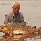 Jeremy Wade with a goliath tigerfish, a giant-sized relative of the piranha and one of the hardest freshwater fish in the world to hook and land