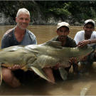 Jeremy Wade with a 161-pound goonch catfish. This catch measured 5 feet, 7 inches from head to tail with a 41-inch girth and 44-inch "wingspan."