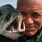 Jeremy Wade with a payara, caught in Uraima Falls in Venezuela. A difficult catch, the payara will swim with the current of the falls when hooked.