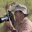 A curious Aztec named Alonzo investigates photographer Heinrich Van Den Berg.