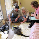 A Meet Your Match worker with potential adopters.