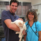 John with Dr. Carol Eddy and a beautifully striped cat.