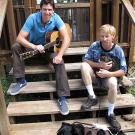 John with Greg Pike playing guitar.