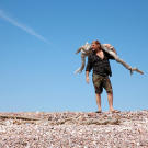 Les Stroud finds driftwood for a fire on Tiburon Island.