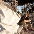Les Stroud with shelter and a sail salvaged from a boat on Tiburon Island.