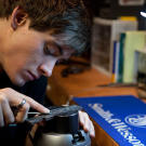 Kurt works his magic on a custom gun plate. Just old enough to legally drink, he's already well on his way to master engraver status.