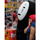 No-Face (a.k.a. Adam Savage) shares a moment with a Comic Con attendee.