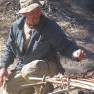 Dave cooks up rabbit caught during the night in one of Cody's snare traps. The meat is a welcome alternative for Dave's red-meat taste buds that were faced with a vegetarian fare of cholla cactus, pine nuts and sweet acorns.