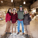 The flying Tweto family — Ayla, Ariel, Jim and Ferno — in one of the cargo hangars at the Unalakleet airport.