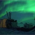 The aurora borealis over a Sirius Patrol tent in northern Greenland.