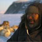 Inuit David Iqaqrialu with his dog team, Clyde River, Canada.
