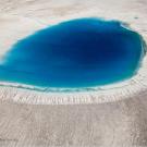 Aerial view of meltwater lake on Greenland's ice sheet.
