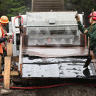 As one of their regular duties, Nathan and Sterling worked with Jim Thurber at the shaker to wash rocks and clear the tailings as they moved through the wash plant.