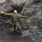 John shows off his first dig at the Big Nugget Mine in 1984. After his "retirement" a couple of years earlier, John got into gold mining almost full-time. The pit he's standing in is the result of two years of digging to reach bedrock
but there wasn't a flake of gold to be found!
