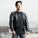Grant Imahara poses atop M5 for a Discovery Channel photo shoot in August 2007.