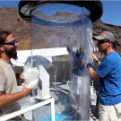 This contraption is called a "shark tube." Made of polycarbonate plastic, the shark tube is only a quarter of an inch thick, but strong enough to resist a great white — at least, shark expert Chris Fallows (right) hopes it is.