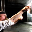 Jamie Hyneman tests golf-ball aerodynamics at NASA's wind chamber in 2009.
