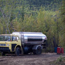 The fuel truck from Dawson stops by to fill up the claim's fuel storage drums. Expenses for diesel - to power both machines and the generator - typically run around $1,000 a day. Gold's not the only commodity that's gone up in price.