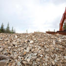 The Quartz Creek miners have to work around the tons of tailings left behind by the dredging operation half a century earlier.