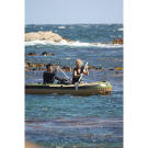 The Hawkes paddle into the rough surf off the Tasmanian coast, just before their raft is "damaged" to simulate the type of traumatic event which often precedes survival situations. The premise for these survival missions is simple: most rescues happen within a few days, and what you do during these first hours often determines if you make it or not.