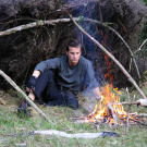 In order to keep the meat moist and prevent all the fats and the nutrients from leaching out, Bear Grylls places his eel meal away from the fire's flames.