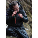Bear Grylls snacks on a small trout during his Iceland adventure. It's only 130 calories, but "every little bit helps."