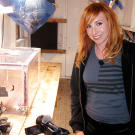Kari Byron poses with the "Gas Room Boom" scale model.