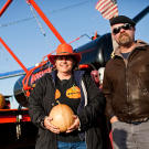 Dawn Thompson poses with Jamie Hyneman — who, along with Adam Savage, hosted this year's Punkin Chunkin competition — in front of her air cannon, Hormone Blaster.