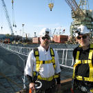 The normally unflappable Jamie Hyneman — here with Adam Savage — stands before the duct-tape bridge, whose jiggling and jostling during his crossing caused him great distress.