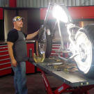 Paul Teutul Jr. regards the Anti-Venom Bike in the early days of its build — and his shop.