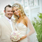 Junior poses on his wedding day with his bride Rachael.