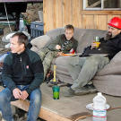 Director of Photography Paul Kirsop takes a lunch break with Todd and the boys on the front porch of the Porcupine Creek cabin.
