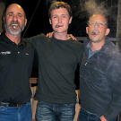 Late arriving miner Chris Doumitt (left) wasted no time sharing his favorite smoking pastime with production crew members, including producers Sam Brown and Sam Maynard.