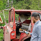 While doing an initial survey of the claim, Dorsey and Director of Photography Duane McClunie check out an abandoned truck probably left behind by mine owner Earle Foster.