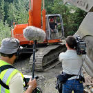 A camera team takes advantage of a brief work stoppage to film Todd at the controls of the excavator. Such intrusions were few and far between, since the production crew did everything possible to stay clear of the miners when they were working.
