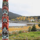 A Tlingit totem standing on the outskirts of Haines, Alaska symbolizes the rich Native American history of the region. The Tlingit reaped bountiful fish harvests from the Chilkat waters for centuries and during the early 1900's, a thriving fish canning industry grew up around Haines. Commercial fishing faded decades ago but the area's pristine beauty, natural wonders and rich history continue to attract thousands of visitors and adventurers.