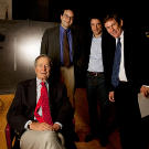 Left to right: President George H.W. Bush with Jules Naudet, Gedeon Naudet, and Chris Whipple.