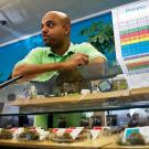 Harborside budtender Terryn Buxton tends to a patient.