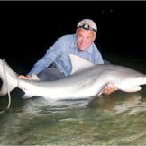Jeremy Wade holds the catch he was really after all along: a bull shark, a species comfortable in both freshwater and saltwater, and responsible for more attacks in the United States than any other shark species.